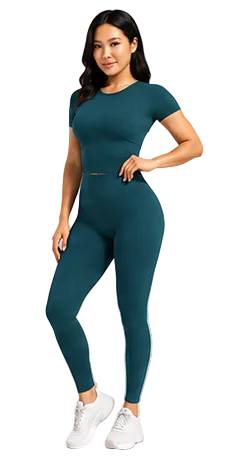 A woman modeling a matching two-piece activewear set consisting of a short-sleeve crewneck top and high-waisted leggings in a deep teal color, paired with white sneakers, against a light gray studio background.