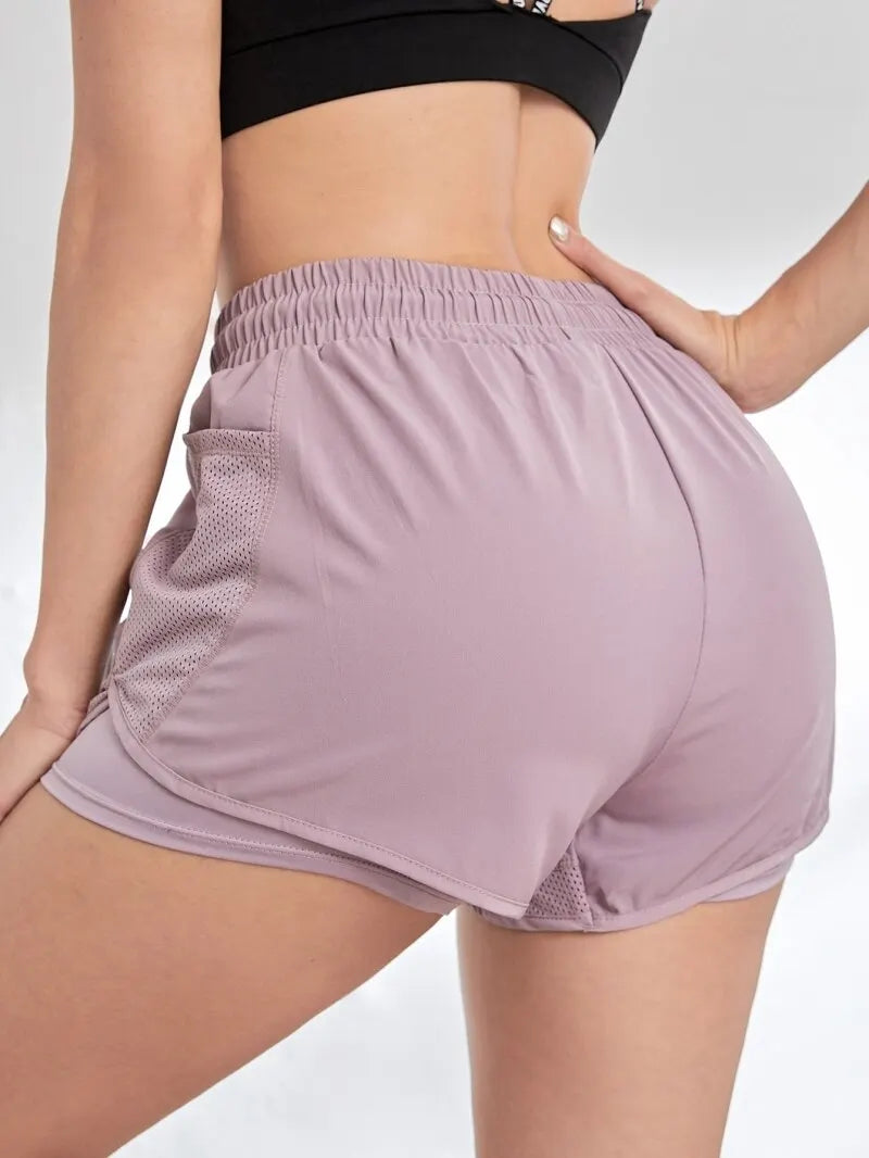 2-in-1 sports shorts with pockets and built-in leggings for women