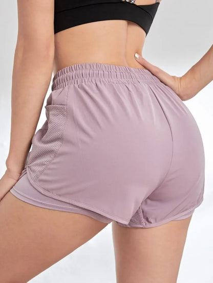 2-in-1 sports shorts with pockets and built-in leggings for women