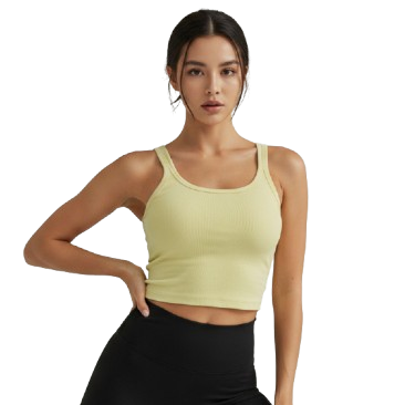 Woman wearing a light green tank top and black leggings on a white background