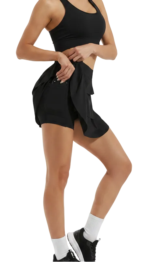 Black shorts with a ruffled design worn by a person on a white background