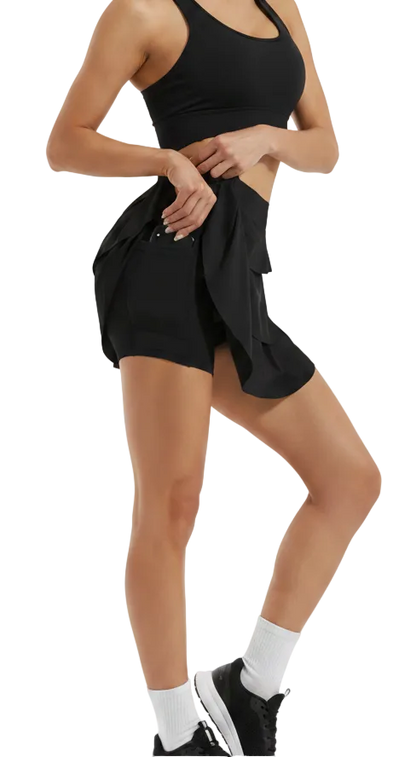 Black shorts with a ruffled design worn by a person on a white background