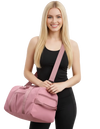 Woman holding a pink duffel bag against a transparent background